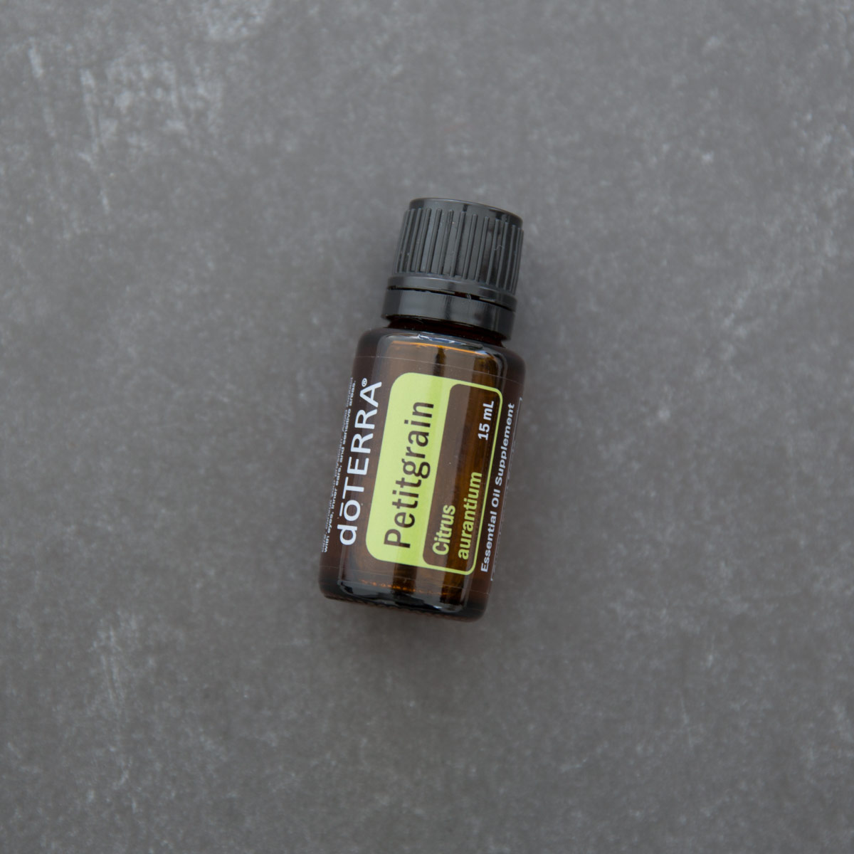 Petitgrain essential oil bottle. Petitgrain essential oil has internal benefits, surface cleansing properties, and can be useful for promoting relaxation. 