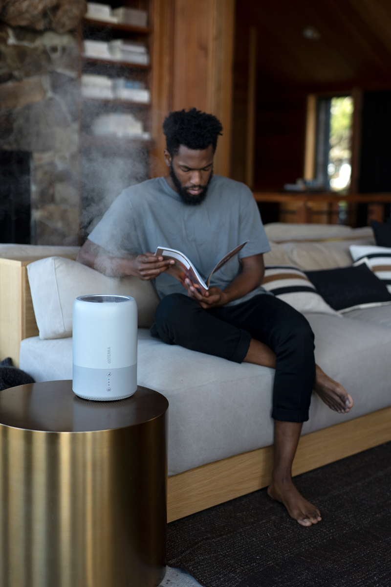 Man sitting with Dawn Aroma-Humidifier on table